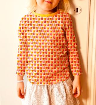 Preview: Baumwolljersey Feather Fan Retrobumen Rottöne auf Creme von jojulein design by Swafing